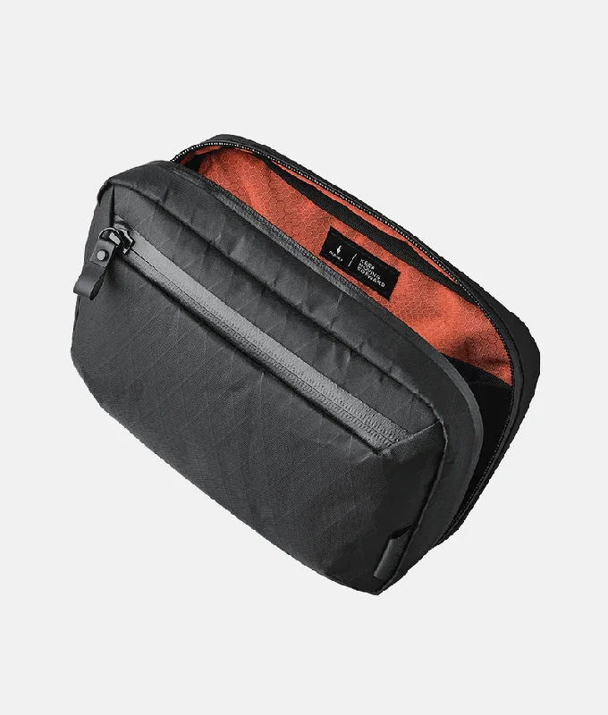 Compact carry - on travel bag with spinner wheels for easy maneuvering in airportsAlpaka Elements Tech Case Sling V2 X-Pac