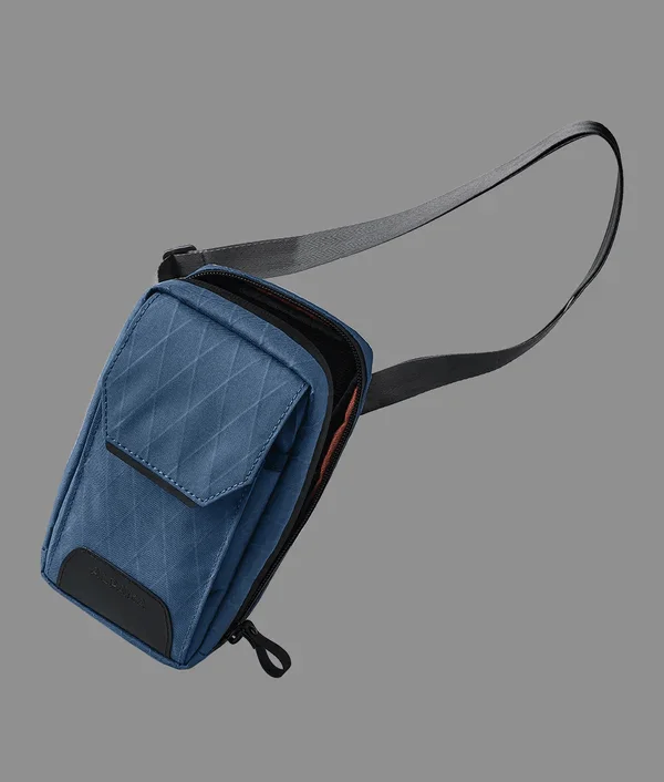 Foldable fabric travel bag for convenient storage when not in useAlpaka Modular Sling - Eco RX30 Edition