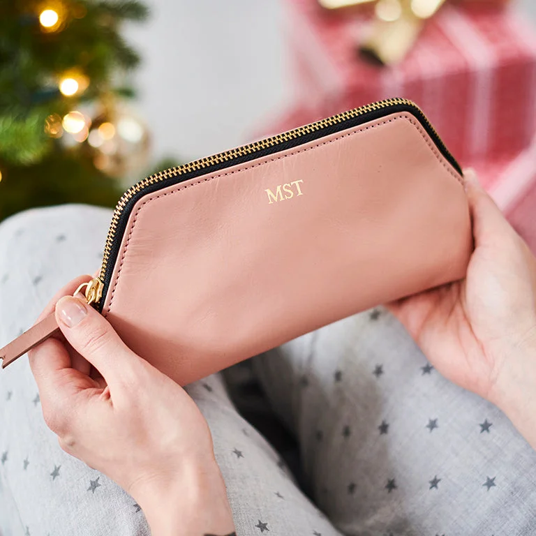 Travel bag with a built - in power bank charger for on - the - go device chargingSolar Leather Cosmetic Case